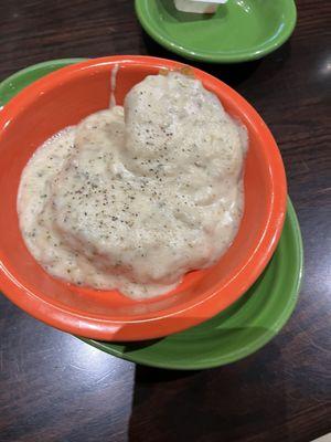 Side of Sausage Gravy with a grilled biscuit.