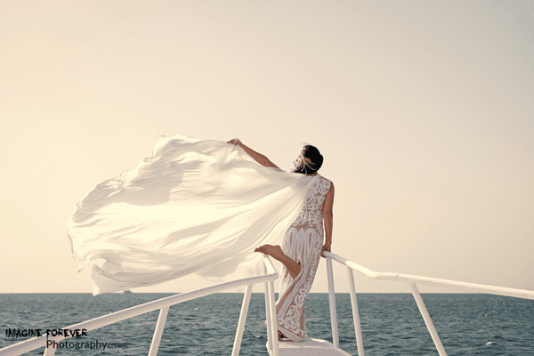 beautiful bride poses at the cruse.