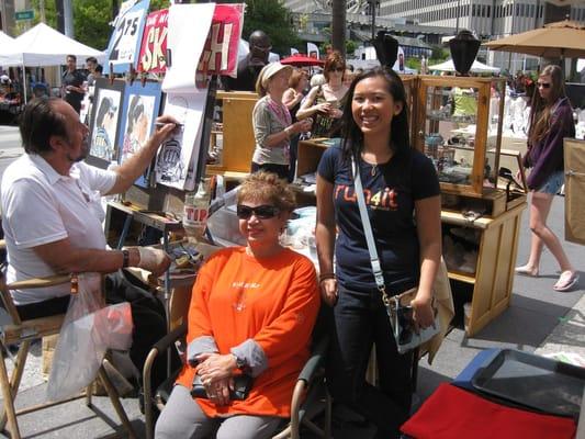 My mom and I caricatures being drawn