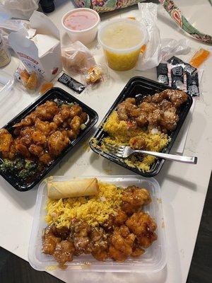 Left Orange Flavor Chicken. Right Sesame Chicken. Egg Drop Soup and Roast Pork Egg Roll and Spring Roll