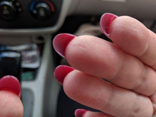 Glue underneath nails at Hapi Nails.