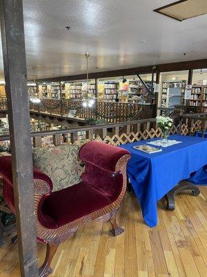 A Book Barn is located in Clovis. This is a photo of part of the second floor and looking down to the first floor.