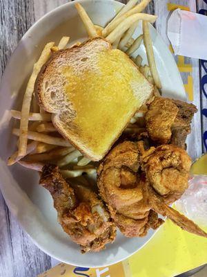 Boasted chicken, toast, and fries