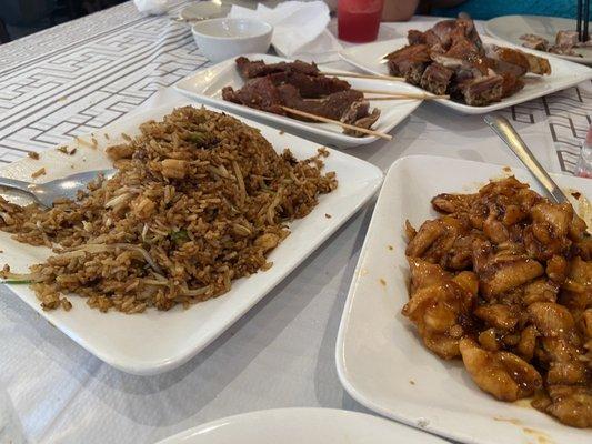 Chicken fried rice, Duck, Chicken with garlic sauce, and beef sticks.