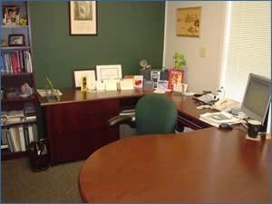 Ahhh... a clear desk (and the systems to keep it so) let this busy professional focus on her clients - instead of clutter.