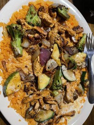 Amigos Fundido- my favorite! Rice topped with grilled chicken, broccoli, zucchini, and onions smothered with melted cheese!