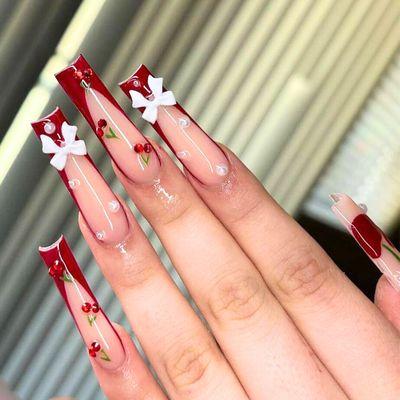 Keep it classic with a twist of holiday glam! French tips are always in style. Add a touch of festive sparkle for your holiday nails!