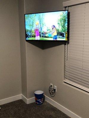 40" flat screen in a tricky corner with cord concealment plugs into power outlet right next to it