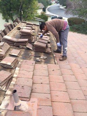 Roofing repair and roof recovering.