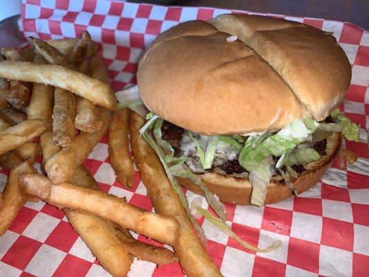 Burger with Swiss and grilled onions and skin on fries