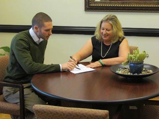 Foreclosure Specialist and Owner of Boardwalk Properties, Patty Edney, meeting with a client.