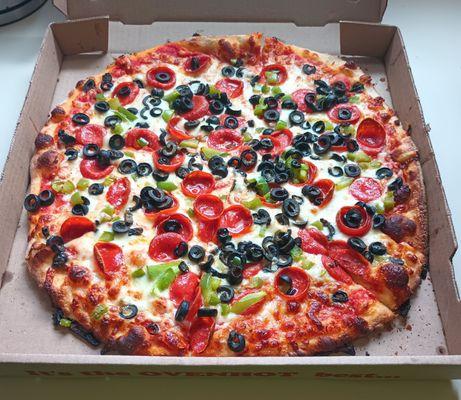 Large pizza with old-fashioned pepperoni, green pepper and black olives. Delicious!