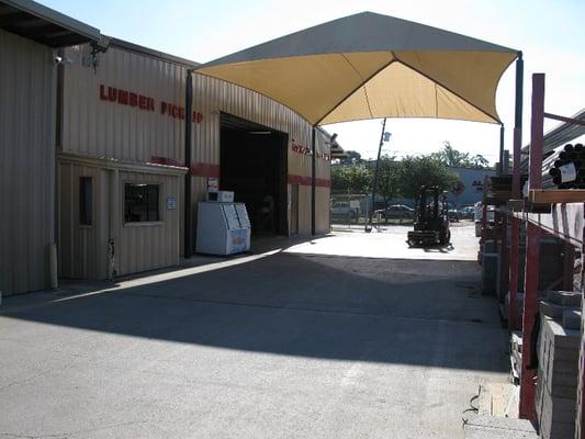 Our drive-through lumberyard has a covered lumber loading lane. You don't even have to get out of your vehicle!