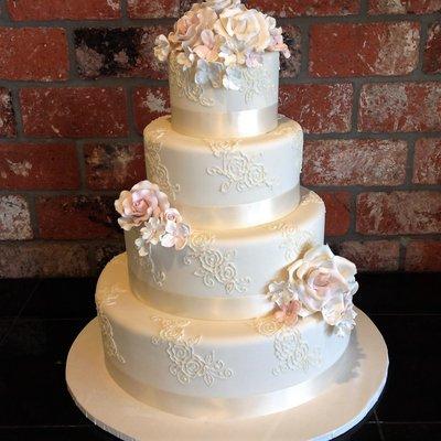 Piping! Sugar flowers! Satin Ribbon! A beautiful cake to match the beautiful bride!