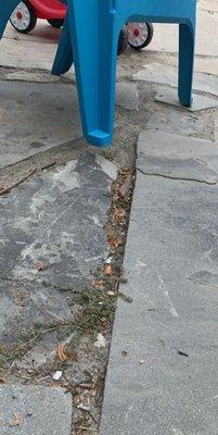 A chair that cannot sit safely on the patio that he laid for me because it's been sinking since a week after it was placed