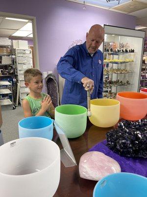 Demonstrating the crystal singing bowls. Wow were they loud!