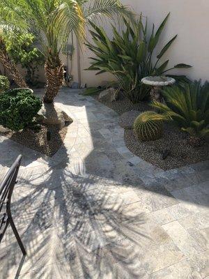 Silver travertine backyard.  Lighting, irrigation and sleeves necessary for future access.