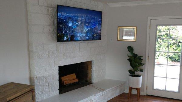 Fireplace install with fireproof conduit