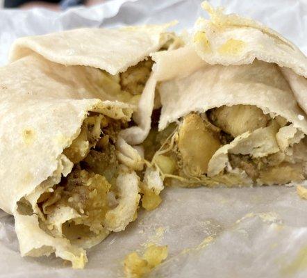 Curry chicken roti (we cut into it that's why it looks like this) just order it though