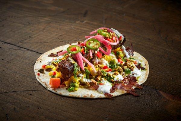 AFGHAN VAN DAMME

Beef Koobideh, Garlic Yogurt, Cilantro Chutney, Pistachio Rice, Pickled Onion, Chiles, Currants, Chihuahua Cheese