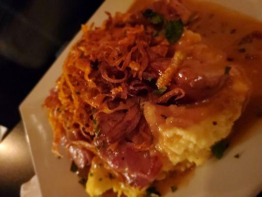 Bacon wrapped pork over grits