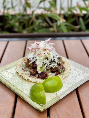 smoky carnitas taco w/ house made heirloom corn tortilla