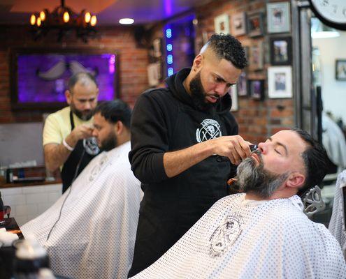 Our brother Flow working on a beard trim.