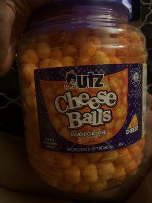 I swear i bought it for the container" she says as she ate the cheesy puff delightfully