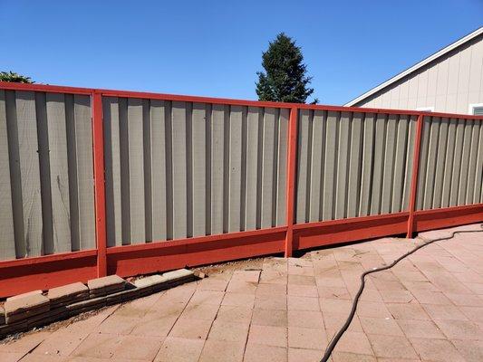 Property fence painted (2 colors)