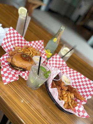 Chicken sandwich and chicken tenders with curly fries! So good!!!! A must when when here!!!