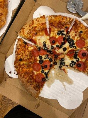 All toppings in the center, huge crust.