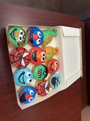 Sesame Street dinosaur and superhero donuts