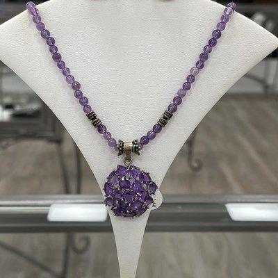 Amethyst pendant with amethyst beaded necklace.