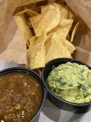 Made in house chips and medium salsa and guacamole.