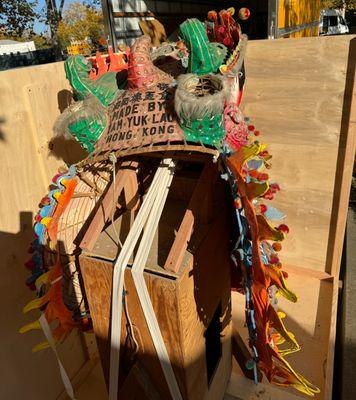 The head of a 150 year-old parade dragon as it was being crated before sending off to Hong Kong for restoration.