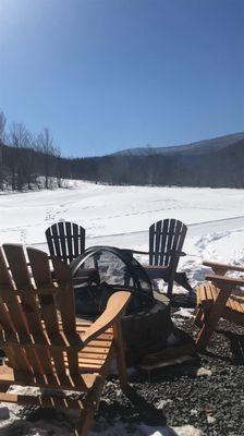 Sit around the fire pit while you watch snow tubing and sledding!