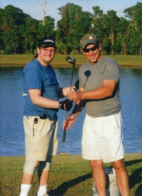 Here is the owner and prosthetist Joe Perretta with client T, a golfer and below knee amputee