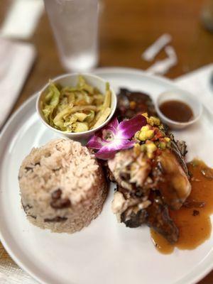 Jerk Chicken, red Coconut Rice and Beans, steamed veggies