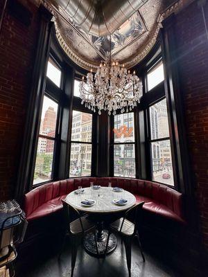 Corner booth with chandelier.