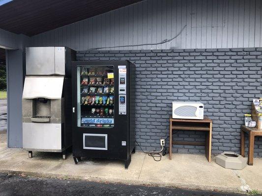 Broken ice machine and outdoor microwave