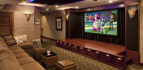 This is a customized home theater room. Fully equipped with concealed speakers, large TV mounted and custom seating.