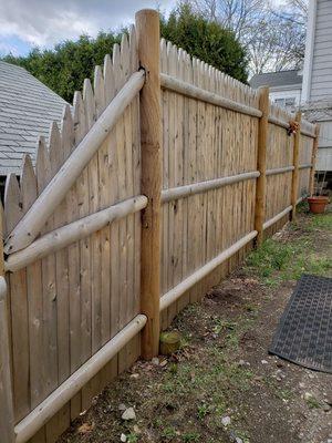 6' Cedar stockade installed last year. Tapered section to transition heights.