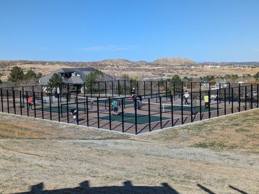 Four pickleball courts that look like they're facing north south so you're not staring directly into the Sun.