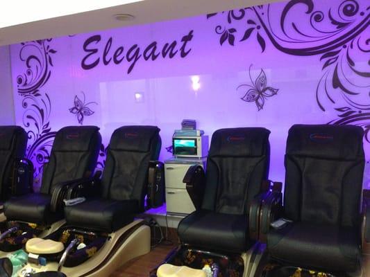 Pedicure chairs with their UV light sanitizer in the middle