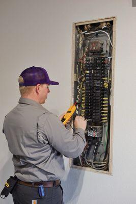 Our Electrician Allen working on a breaker box