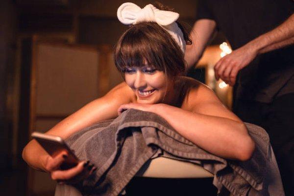 Woman relaxing in her home enjoying a comfortable massage