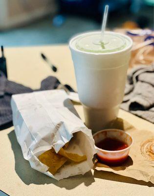 Two Empanadas filled with Nutella with strawberry dipping sauce! Mango Pineapple slush!