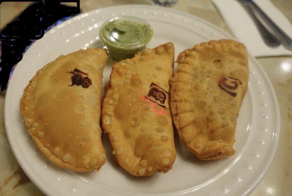 Chicken, beef & spinach empanadas with a cilantro garlic dipping sauce