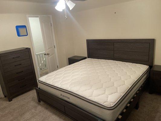 King size bed, two nightstands, and a 5 drawer chest.