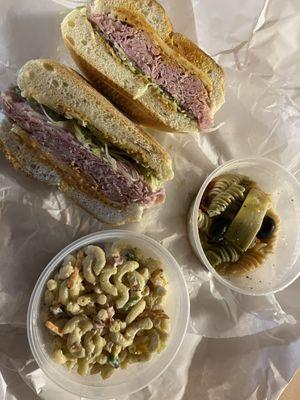 Macaroni salad, pasta salad and spicy ham on roll